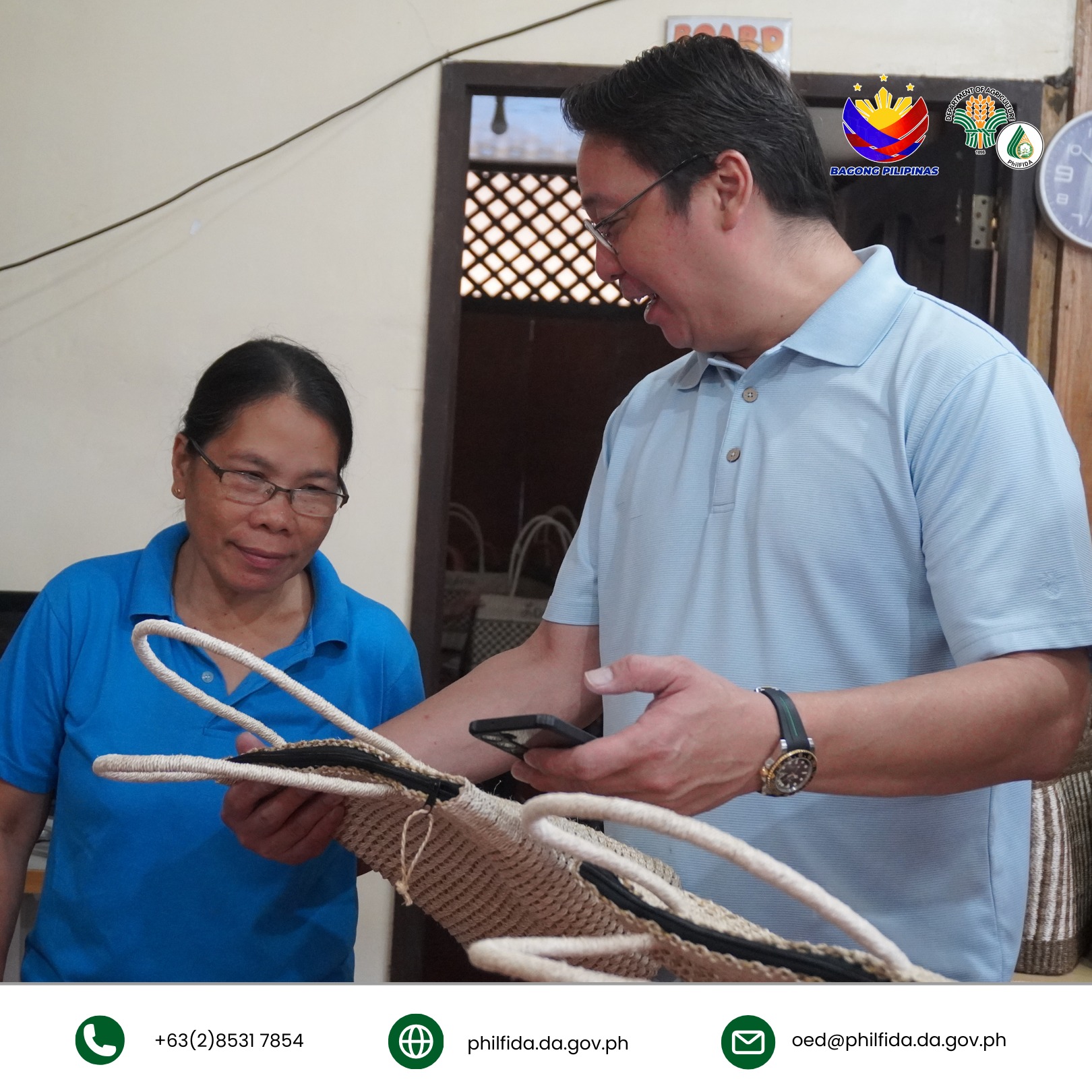 A man closely inspecting a bariw handicraft, examining its intricate weaving and texture.