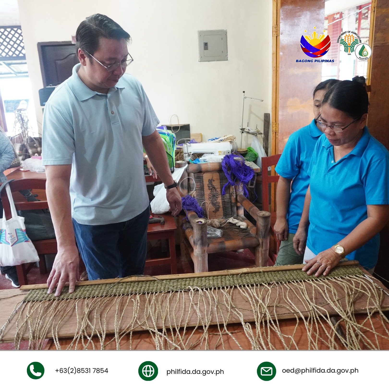 A man closely inspecting a bariw handicraft, examining its intricate weaving and texture.